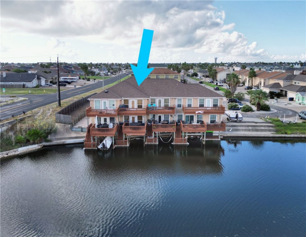 a swimming pool with outdoor seating and lake view