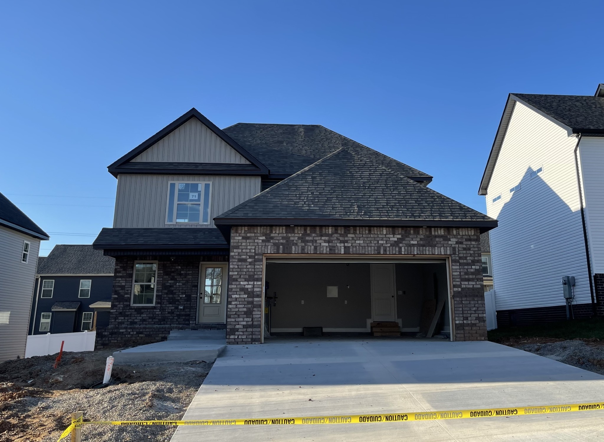 a front view of a house with yard