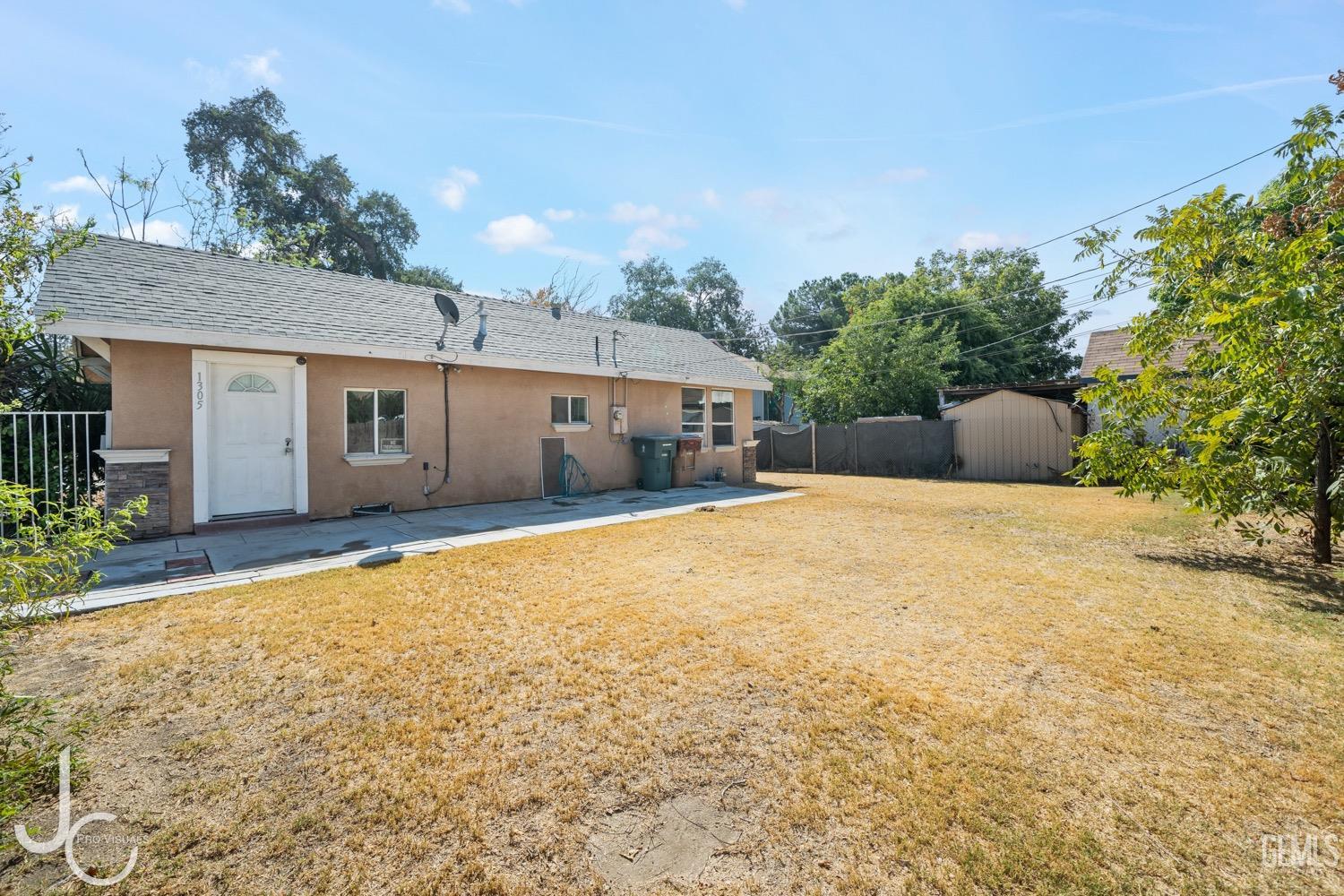 a front view of a house with a yard and a garage