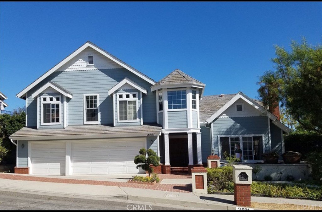 a front view of a house with garage