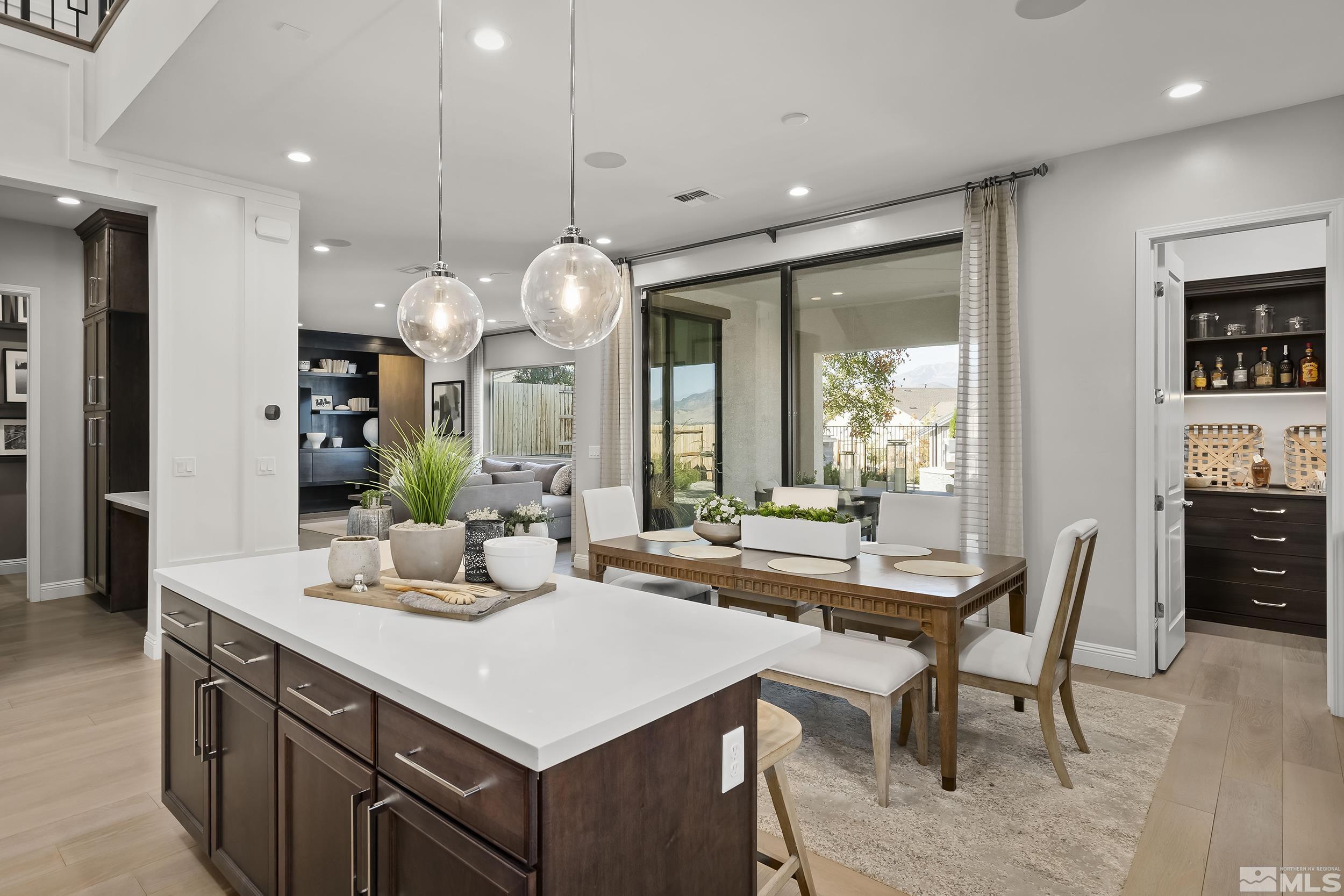 a kitchen with a table and chairs in it