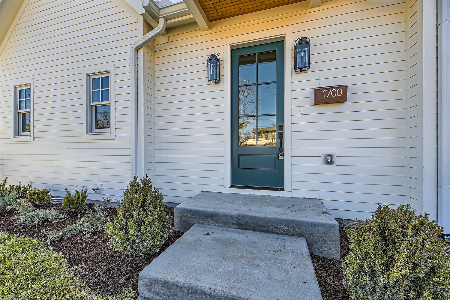 a view of front door and potted plants