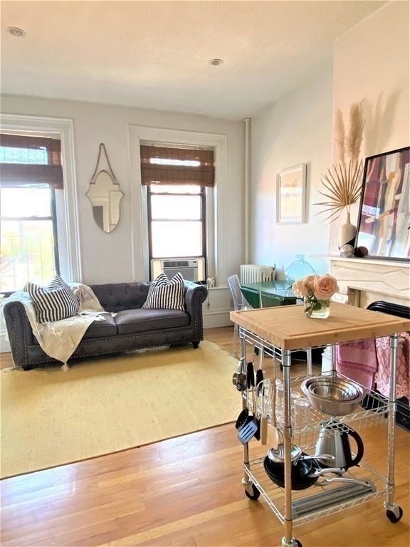 a bedroom with furniture and a wooden floor