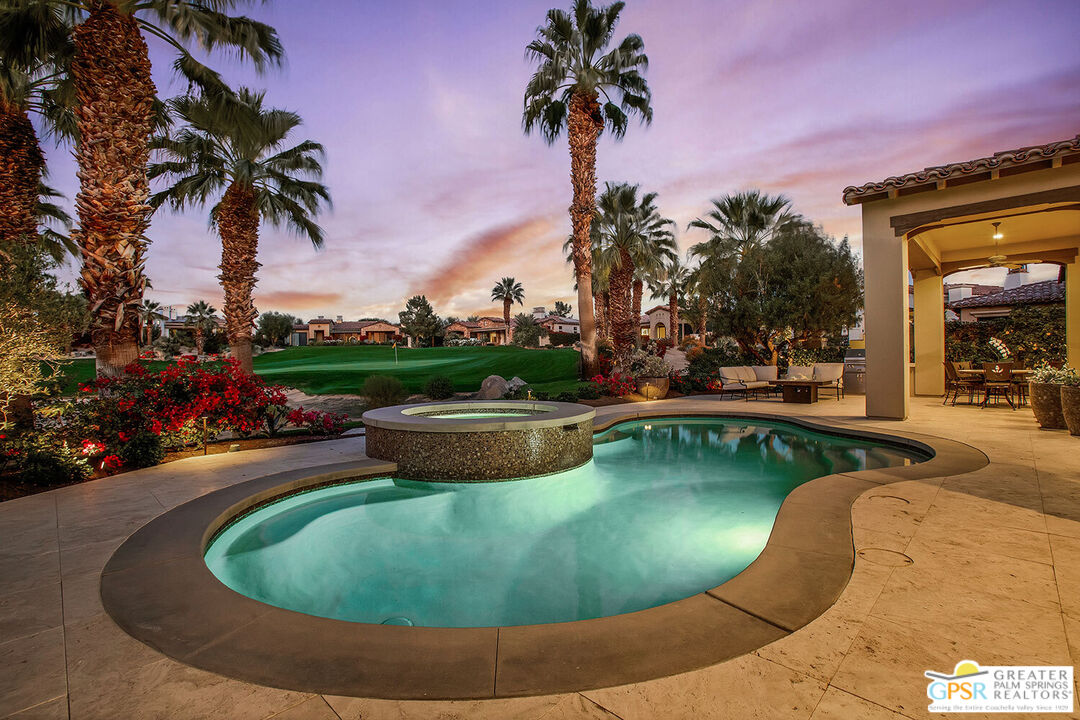 a view of a swimming pool with a garden