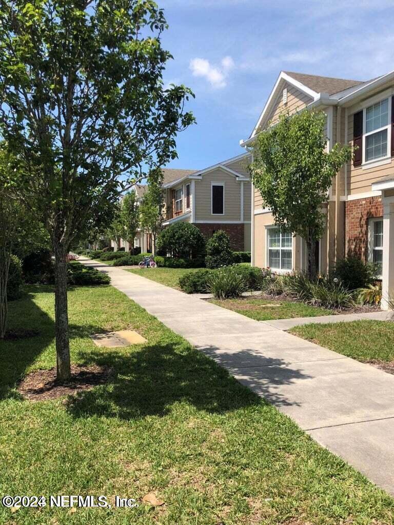 a view of a yard in front of a house