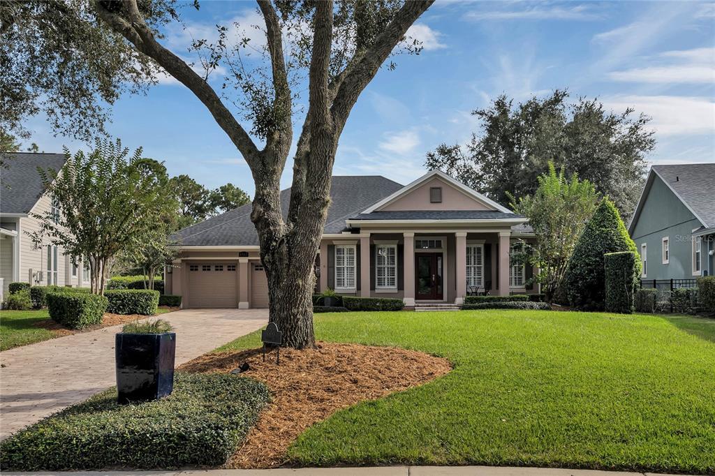 a front view of a house with garden