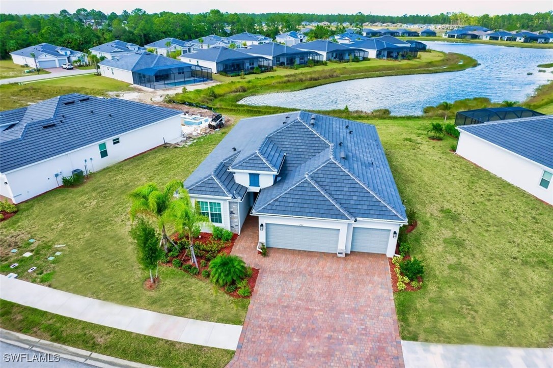 an aerial view of a house with a garden and swimming pool