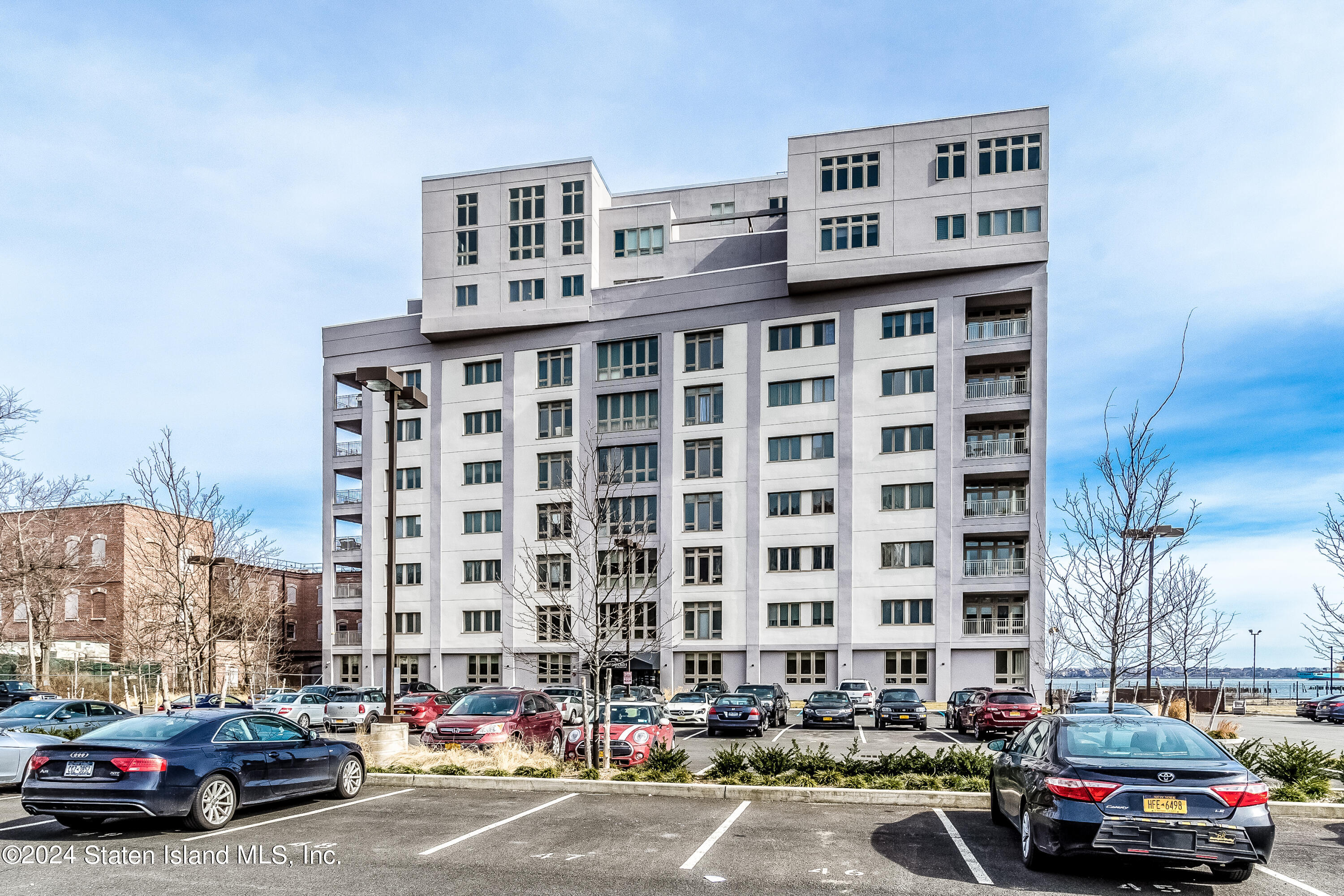 a front view of a building with parking space