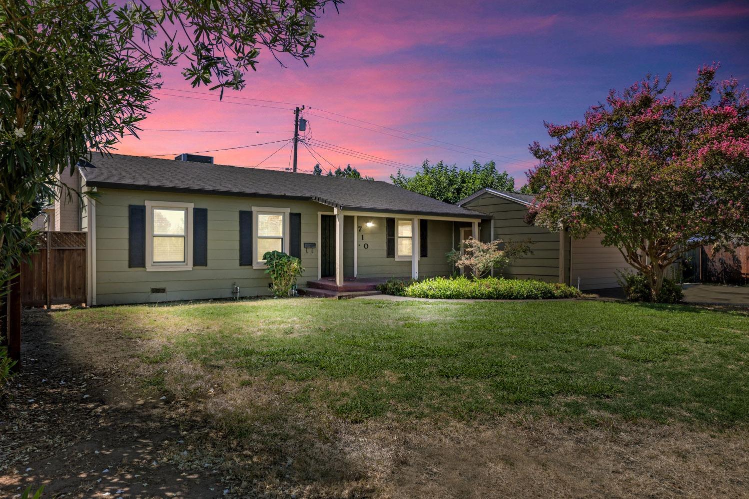 a front view of a house with garden