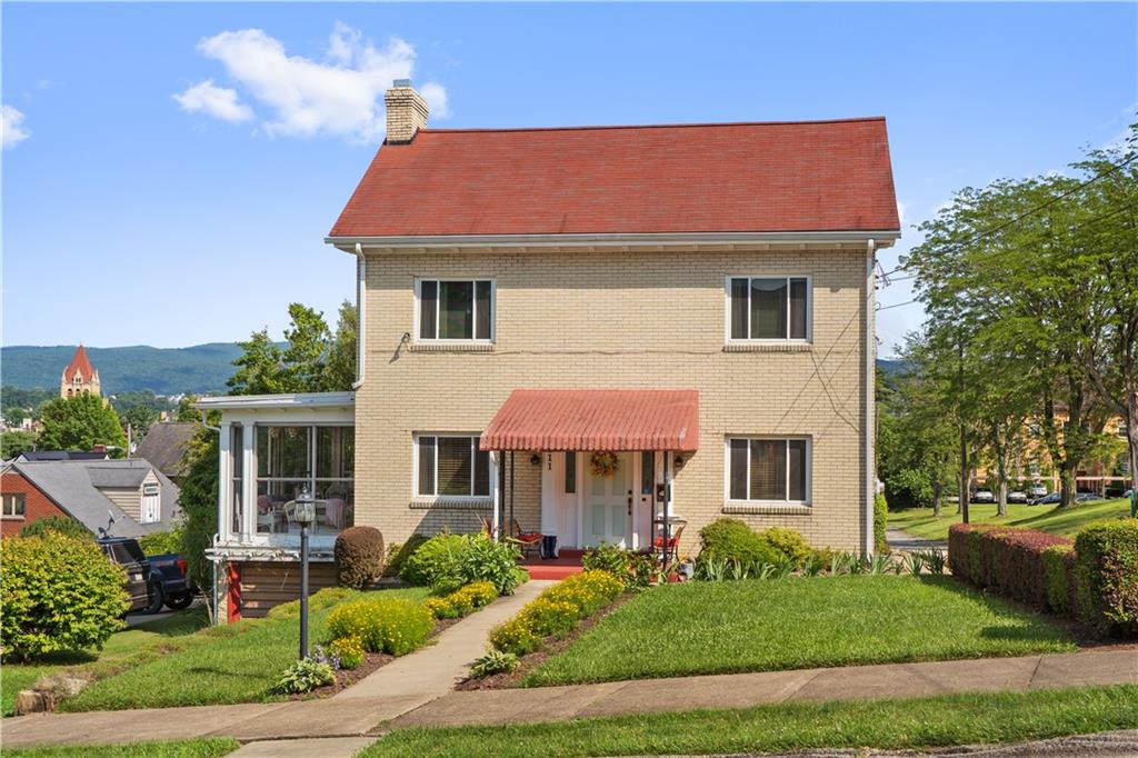 a front view of a house with a yard