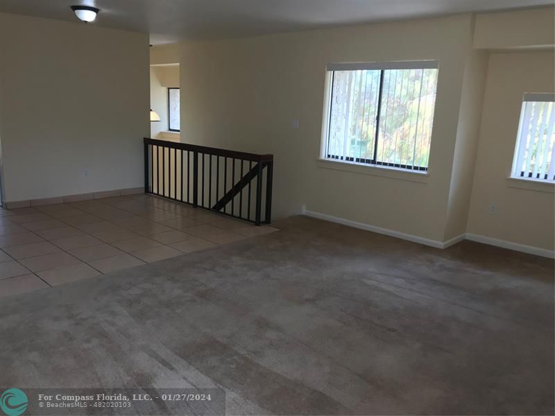 a view of an empty room with windows