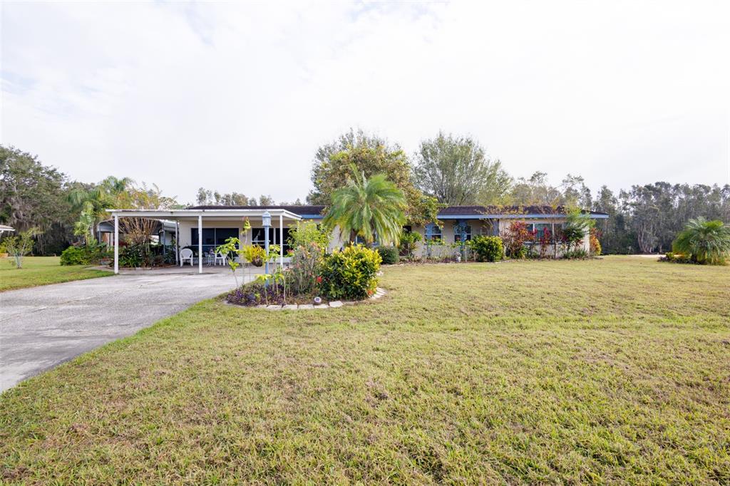 Front exterior.  The home has a two-car garage and two-car covered space.