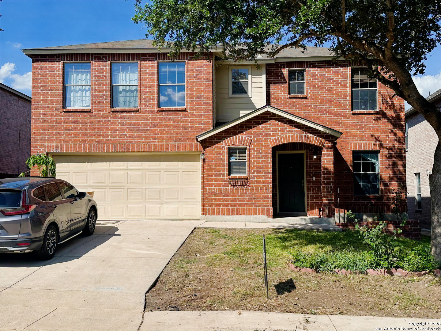 front view of a house with a yard