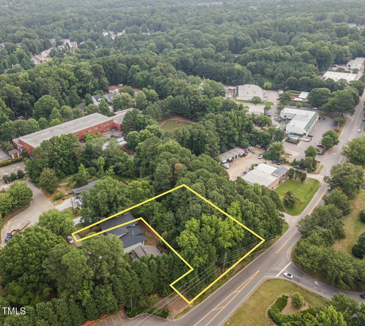 an aerial view of house with yard