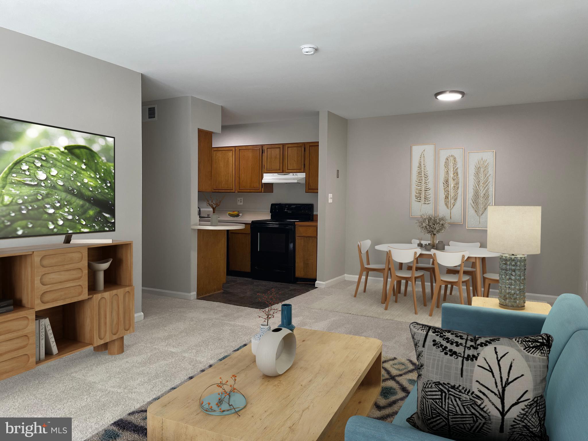 a living room with furniture and a open kitchen view