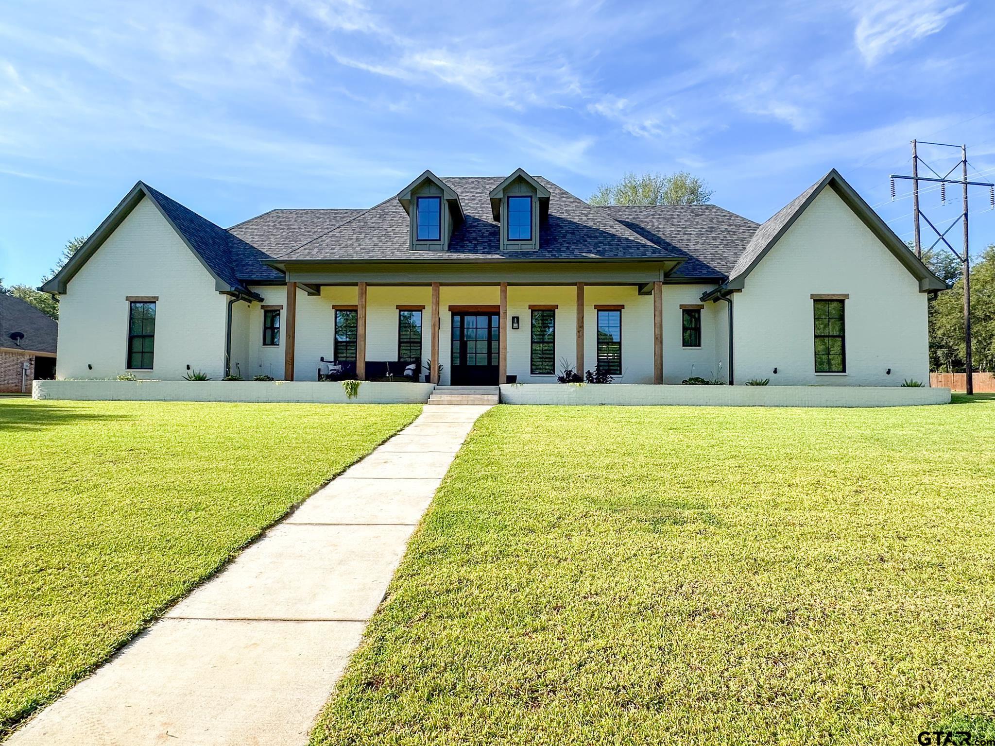 a view of a house with a swimming pool