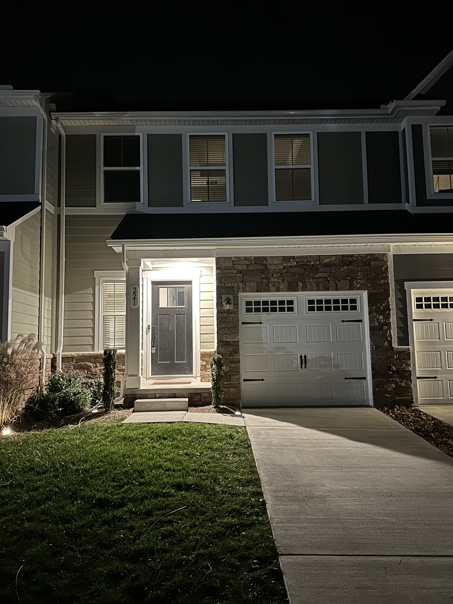 a front view of a house with a yard