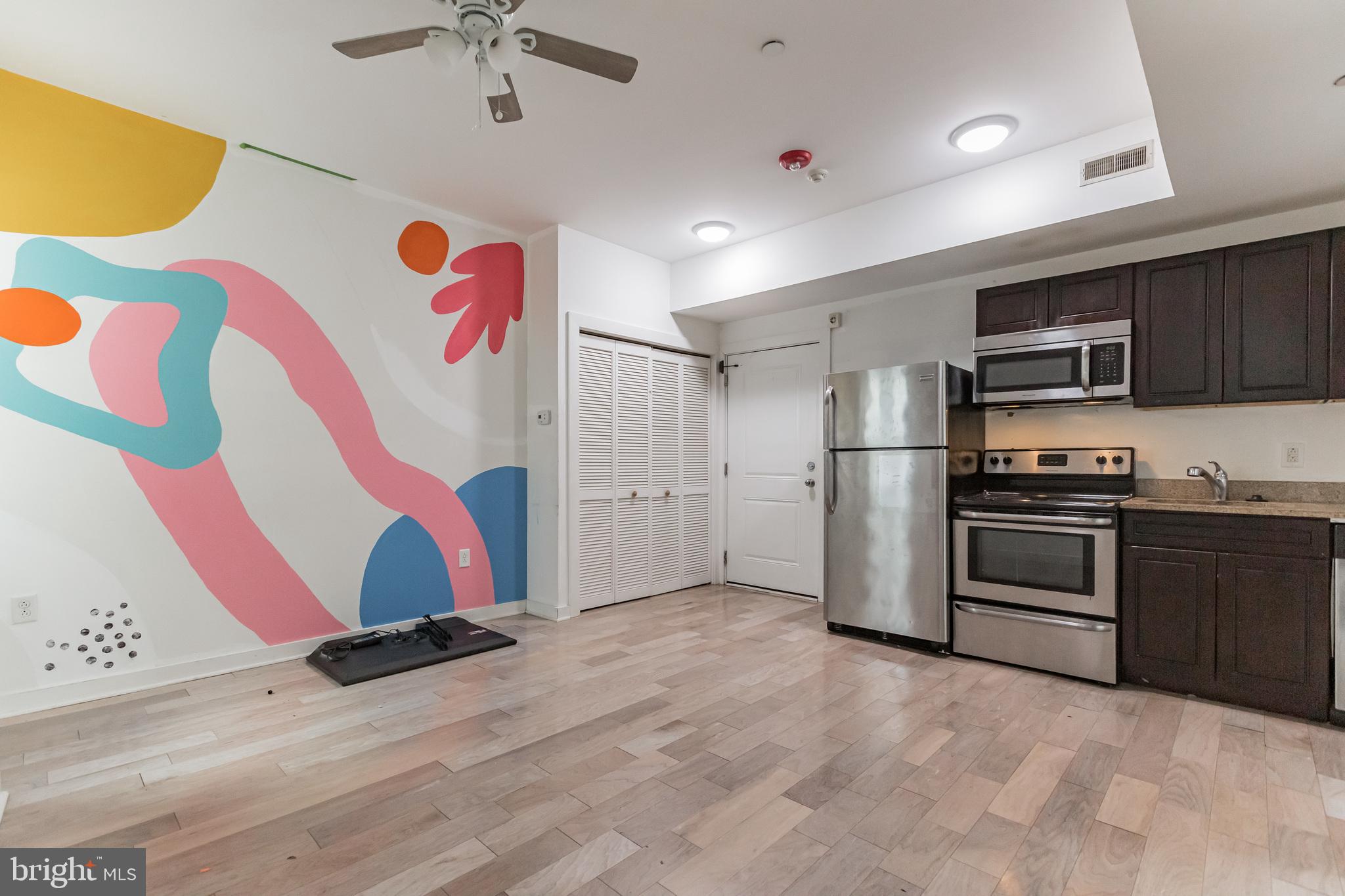 a kitchen with a refrigerator and a sink