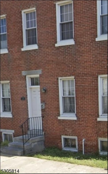 a front view of a house with yard