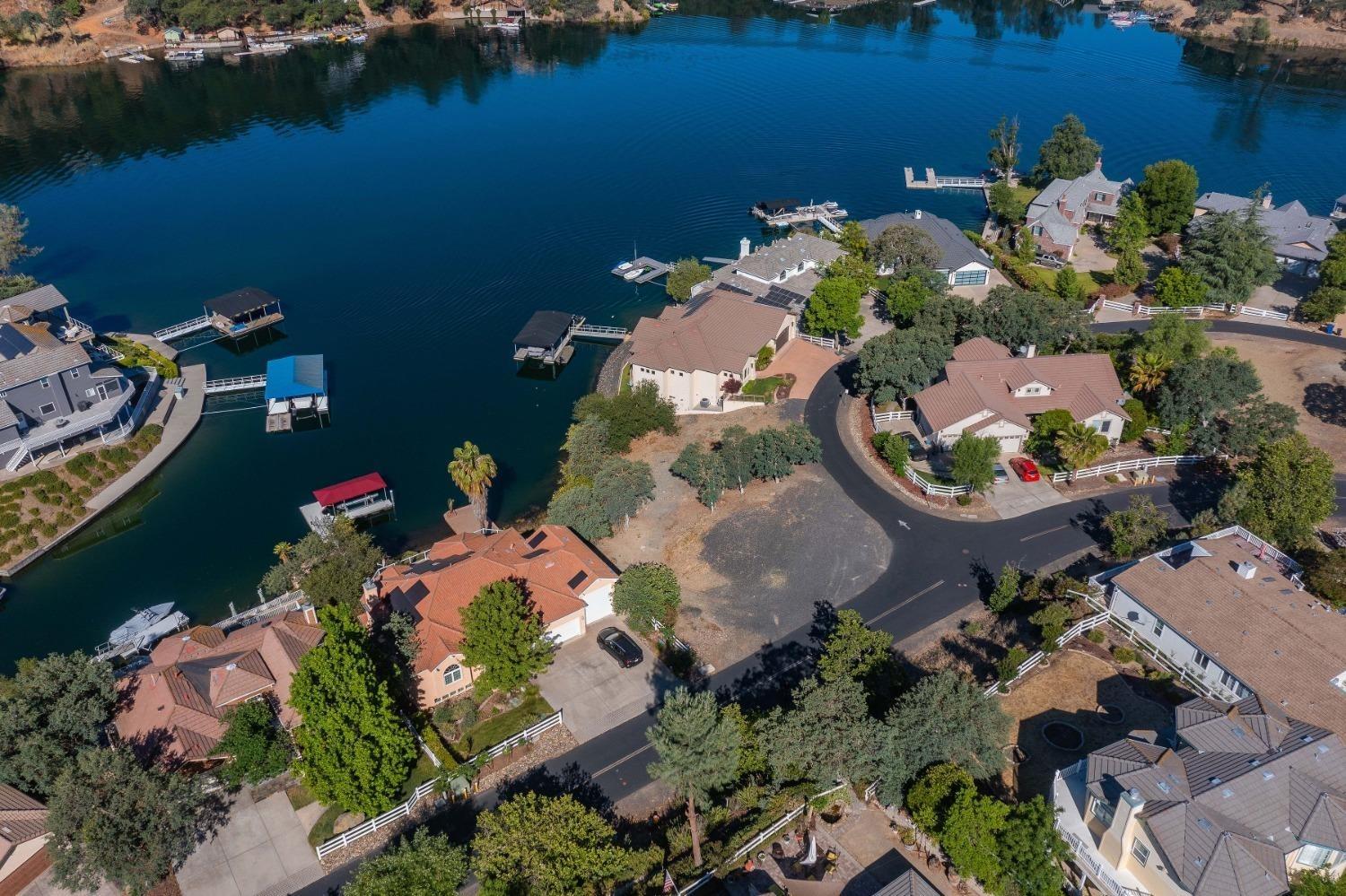 an aerial view of a house with a lake view