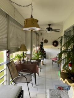 a view of a patio with a table and chairs