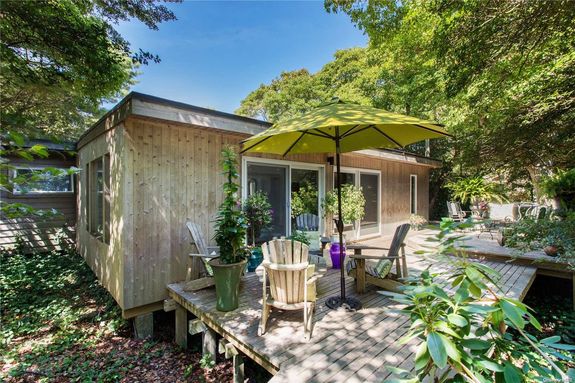 a view of a chair and table in the patio