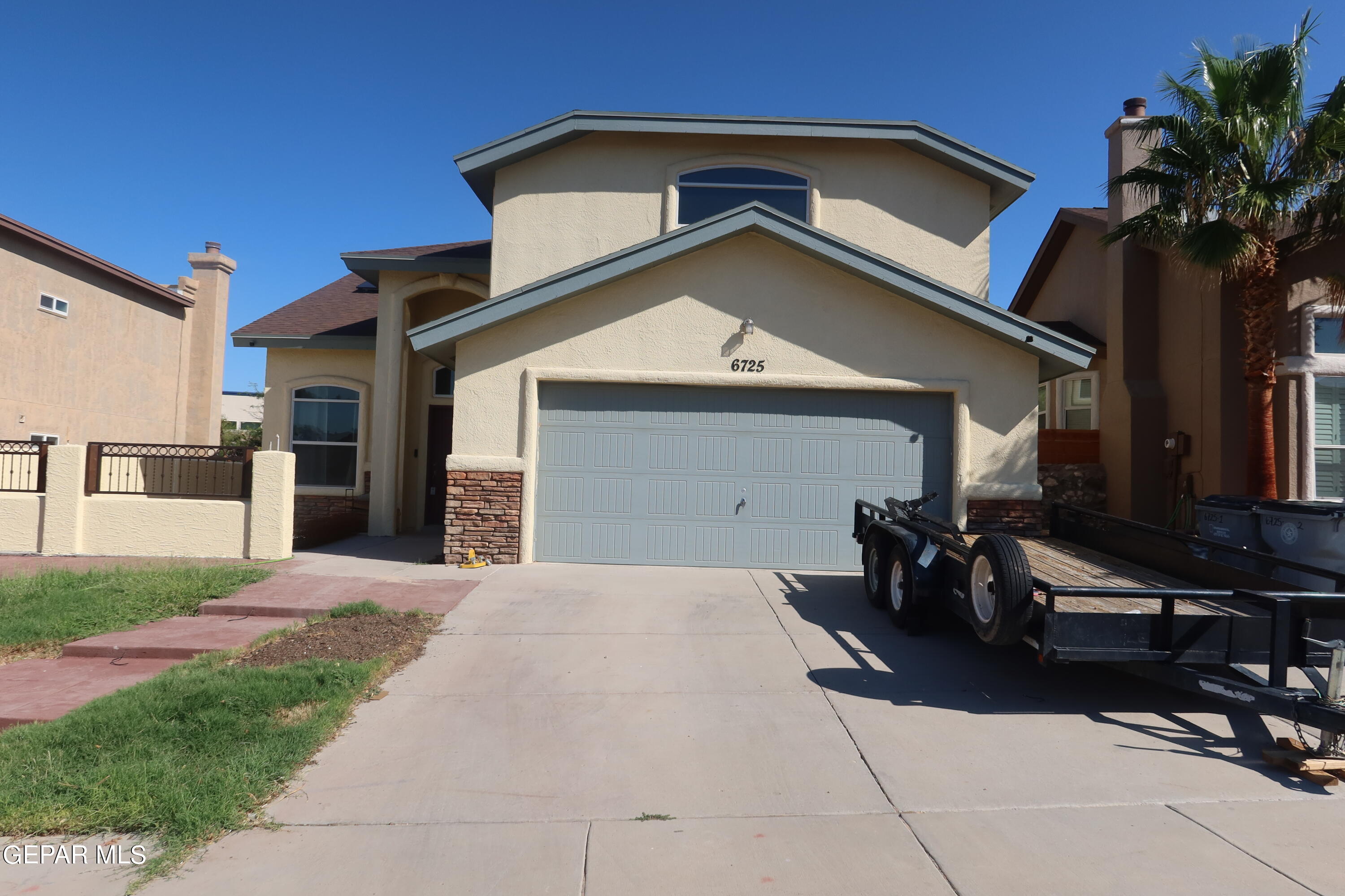 a front view of a house with yard