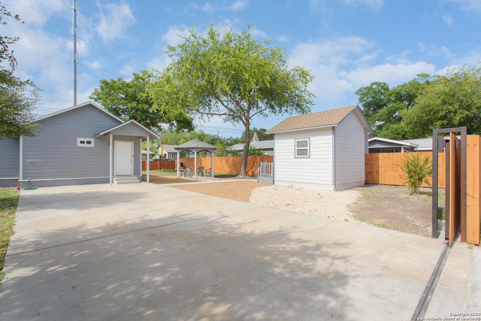 a house with trees in the background