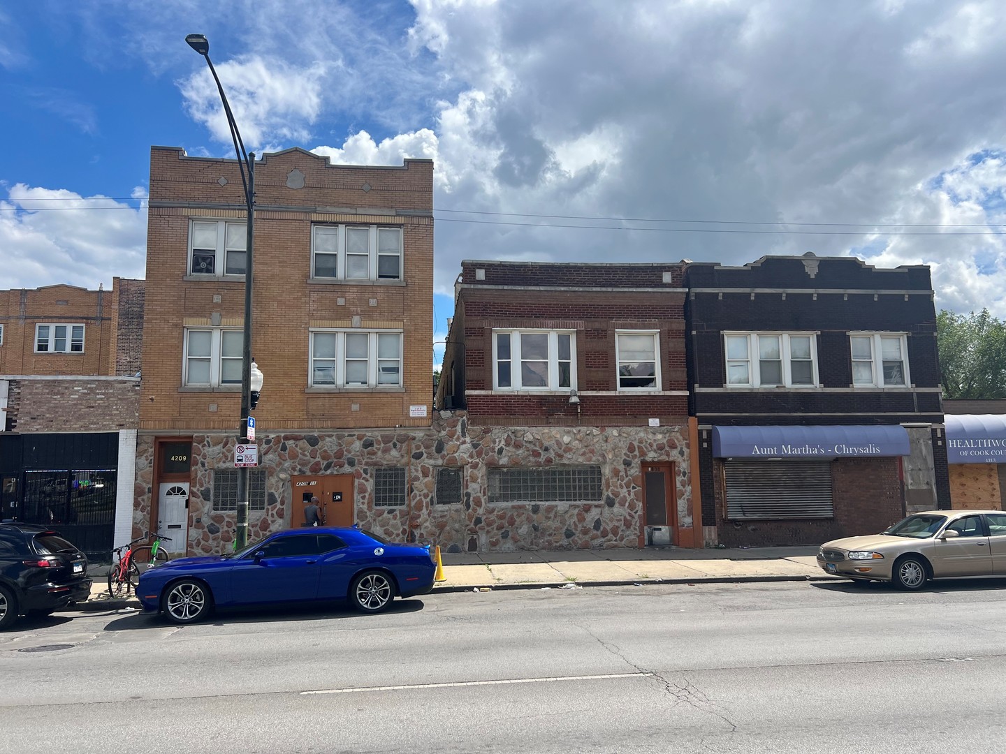 a cars parked in front of a brick building