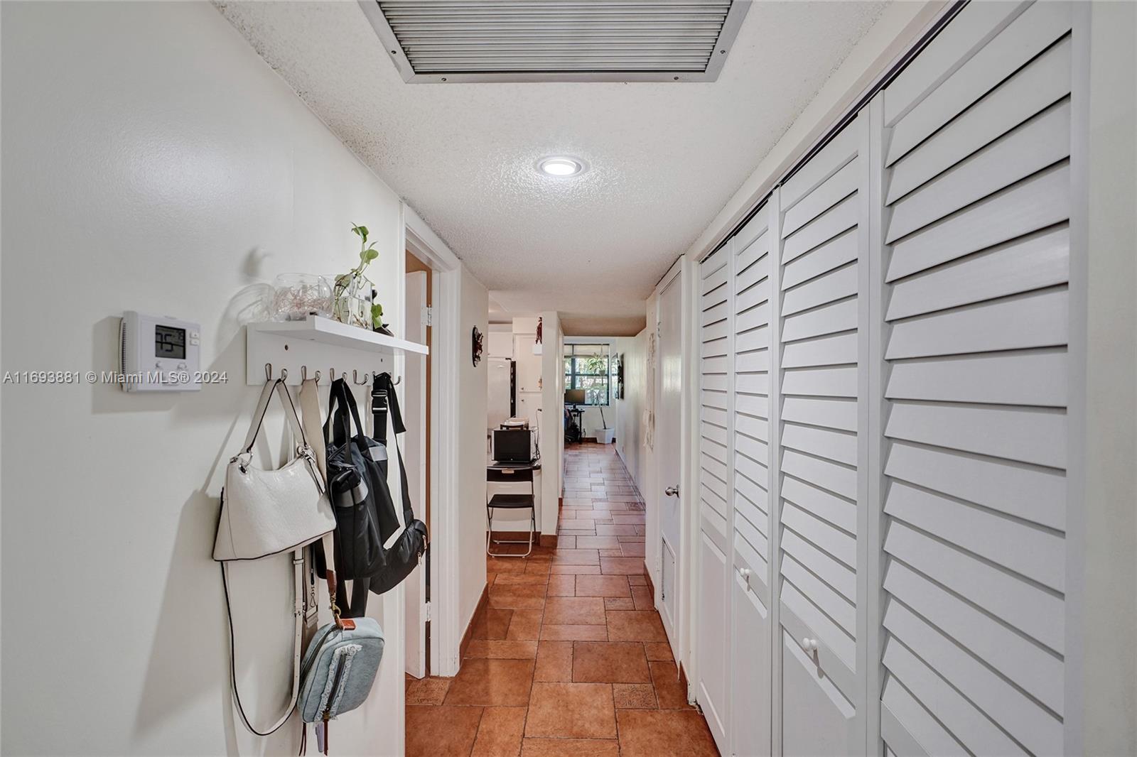 a view of a hallway with a furniture