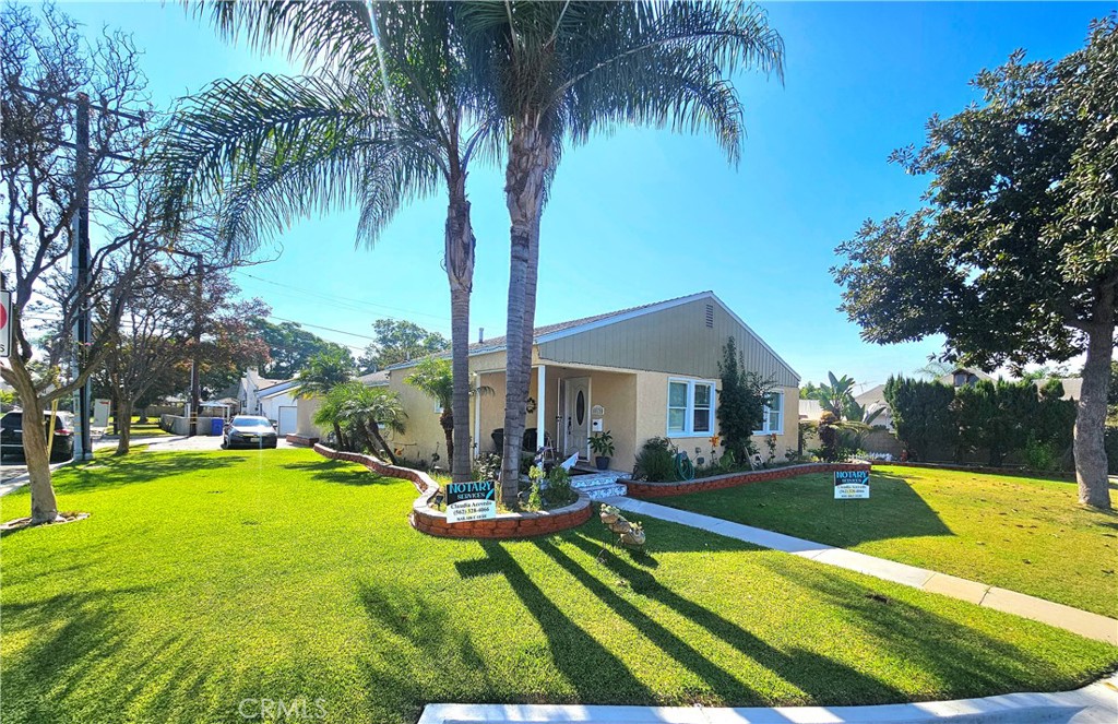 a view of a house with swimming pool and sitting area