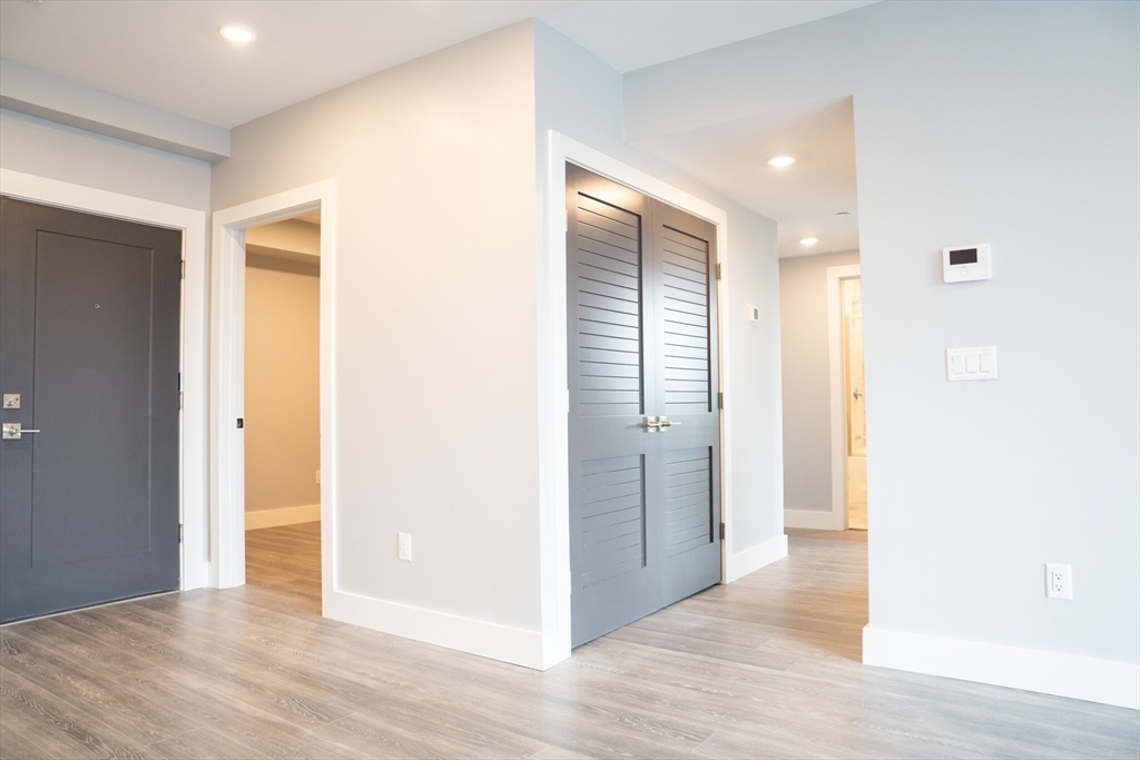 a view of entryway with wooden floor