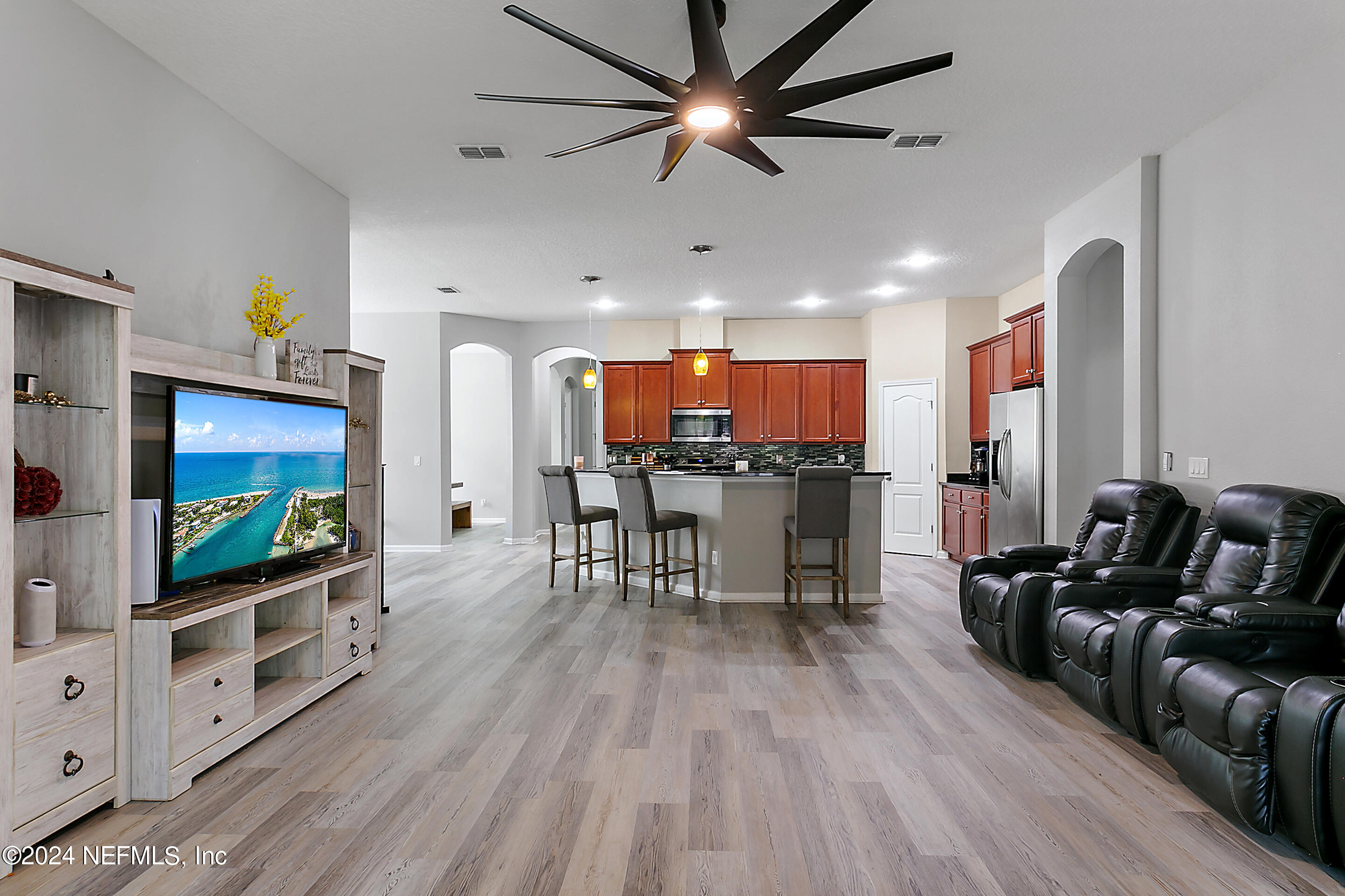 a living room with furniture and a flat screen tv