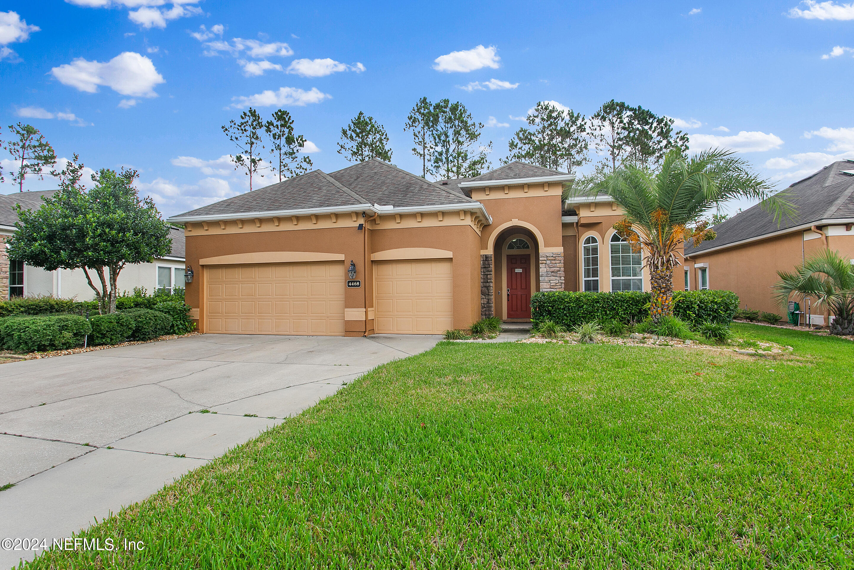 a front view of a house with garden