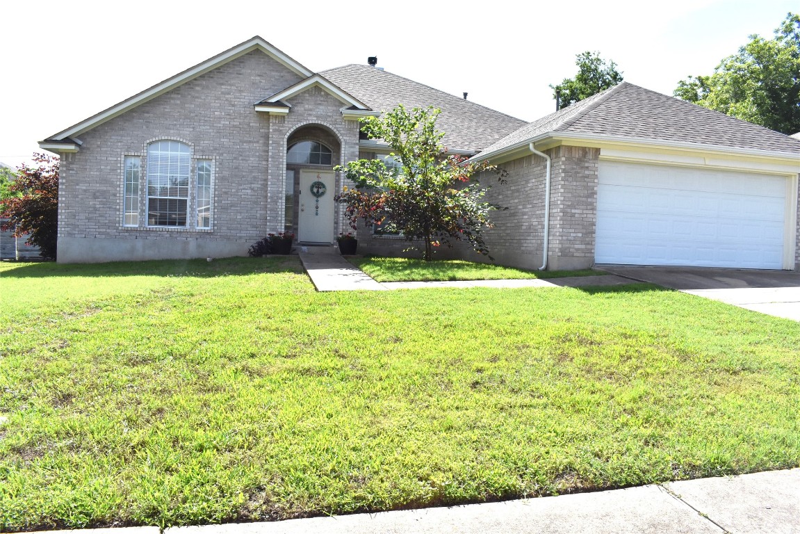 a house view with a garden space