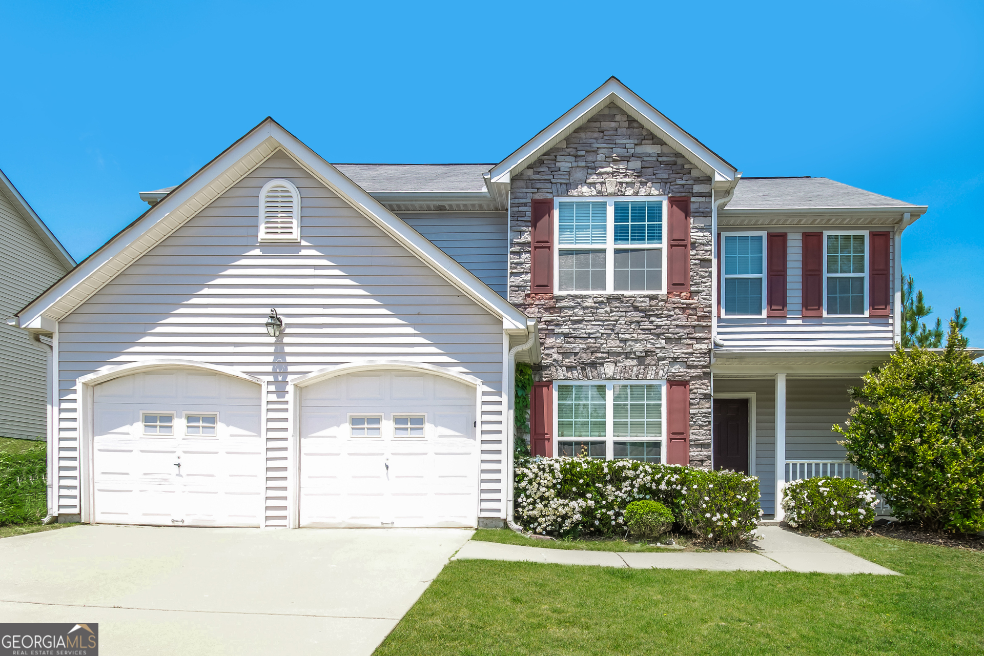 front view of a house with a yard