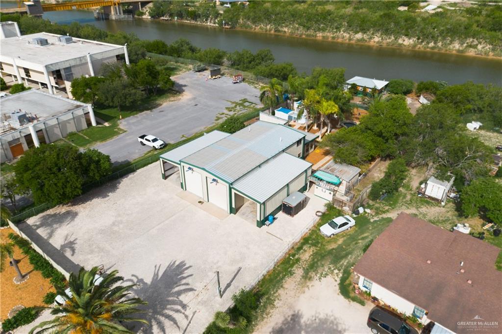 an aerial view of a house with a lake view