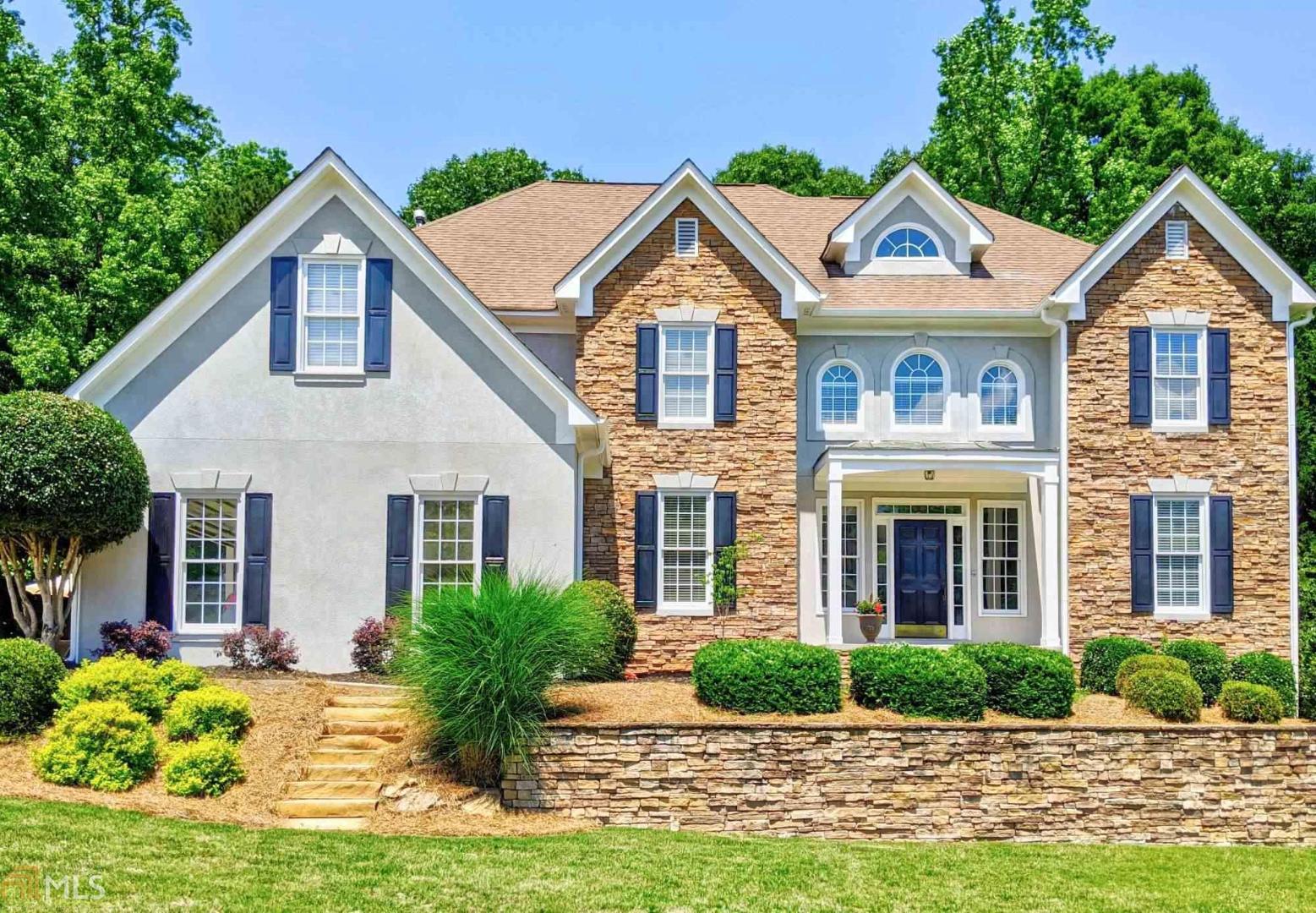 a front view of a house with yard