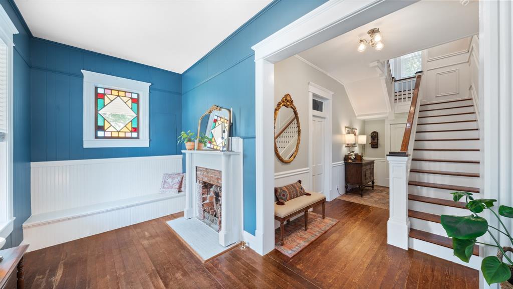 a view of living room with furniture and wooden floor