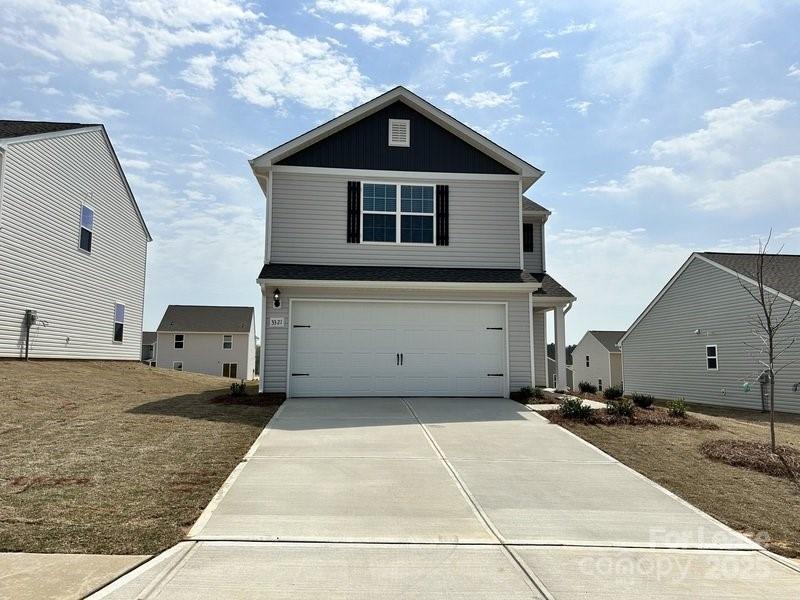 a view of a house with backyard space