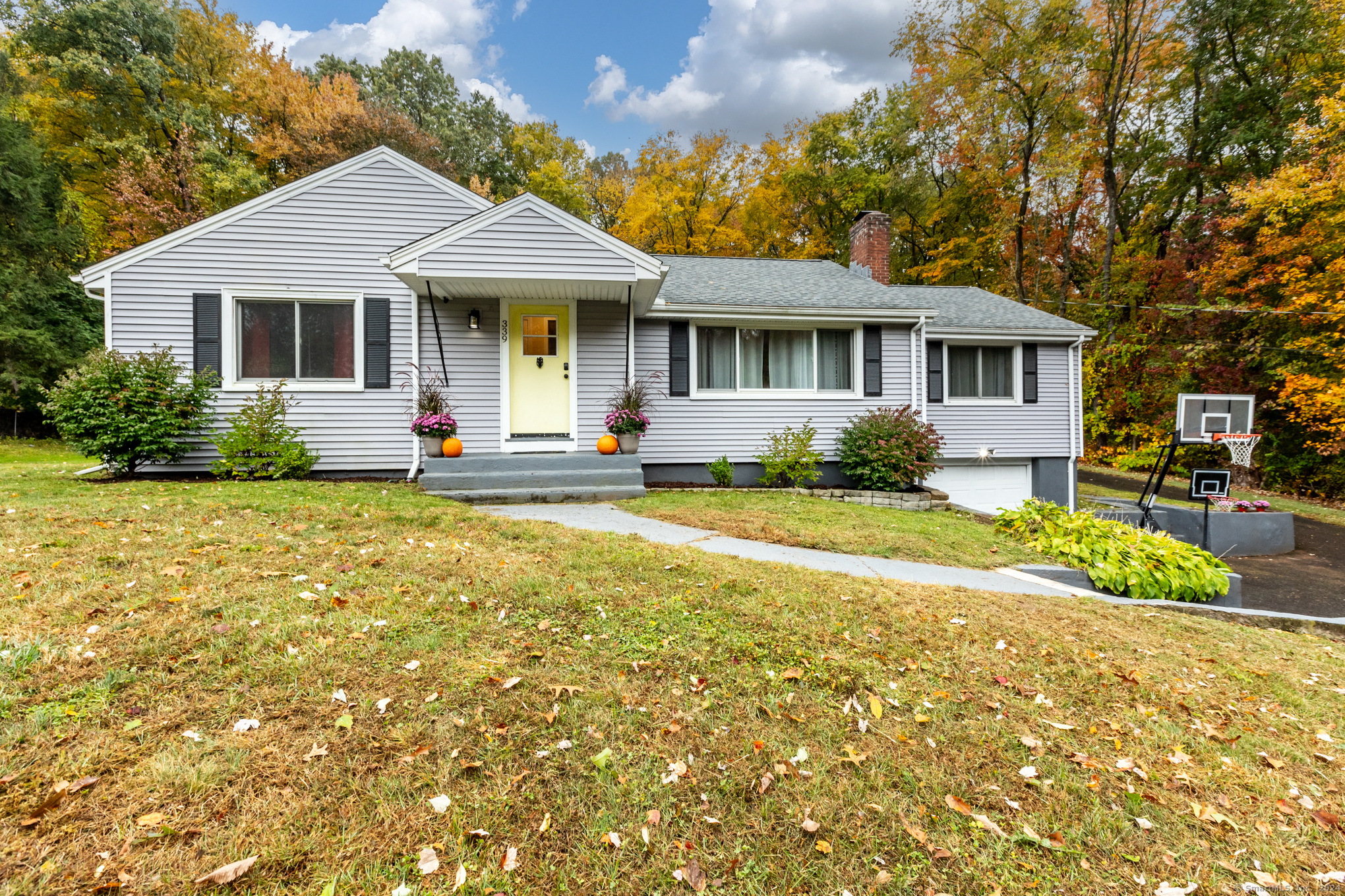 a front view of a house with garden