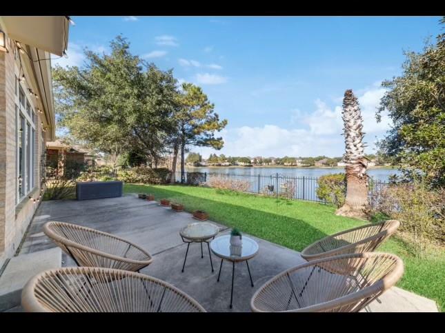 a view of a patio with a table and chairs