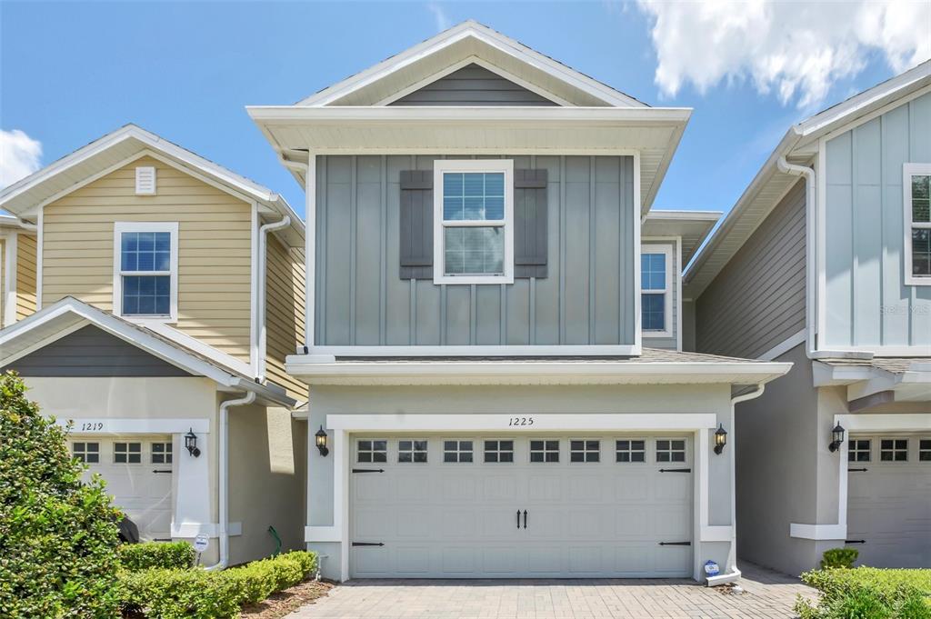 a front view of a house with garage