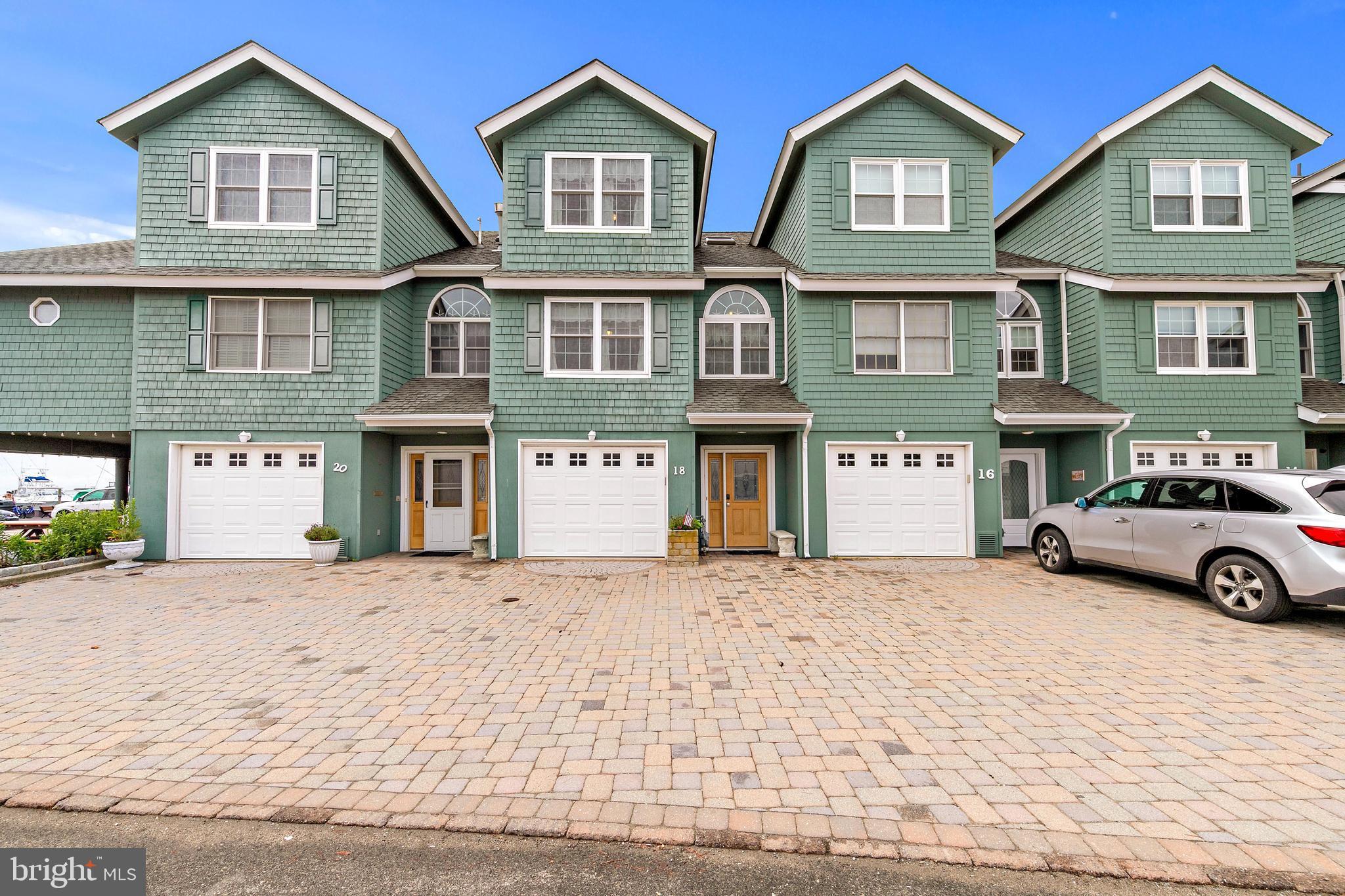 a view of a car parked in front of a brick house