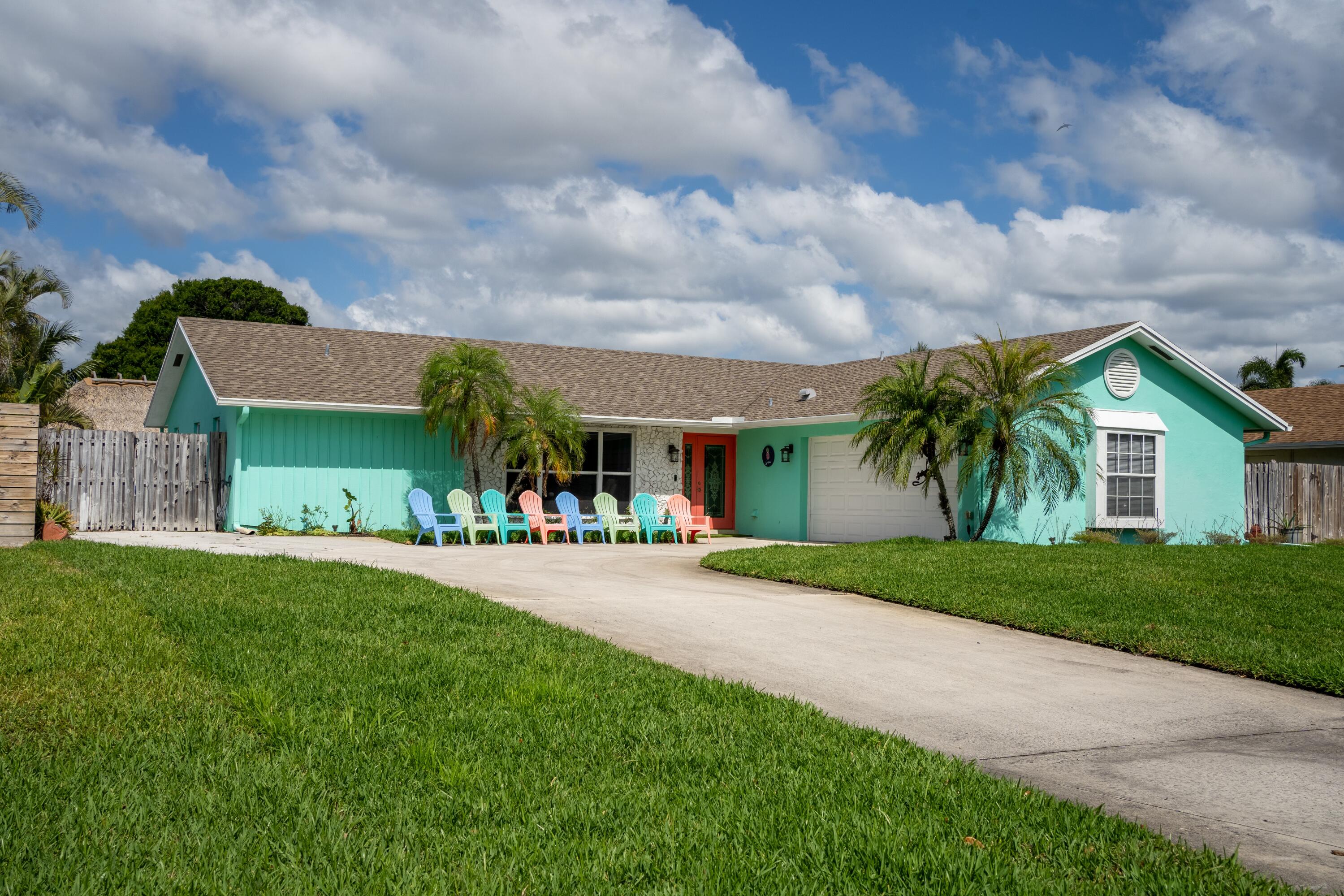 a front view of house with yard and green space