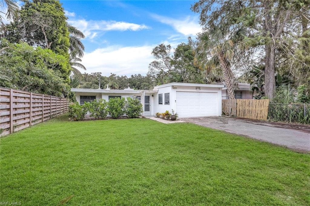 a view of backyard with green space