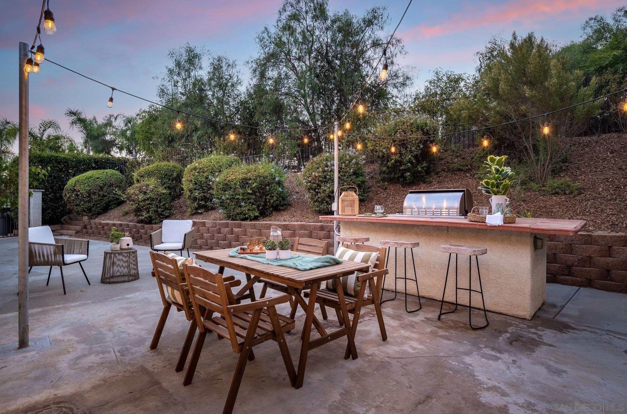 a view of a dinning table and chairs in the patio