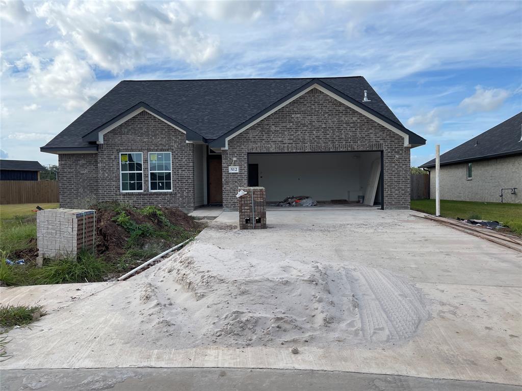 a front view of a house with garage