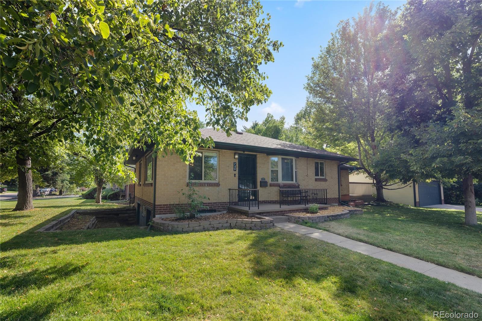 a house that has tree in front of it