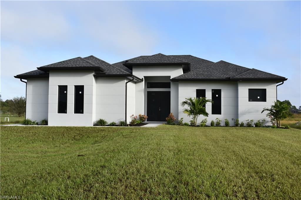 Prairie-style house with a front lawn